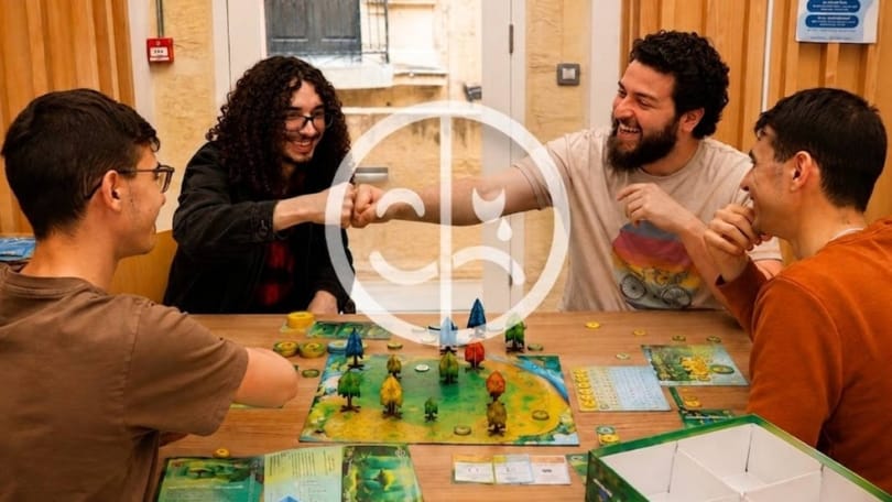 Friends laughing and reacting during a competitive board game session