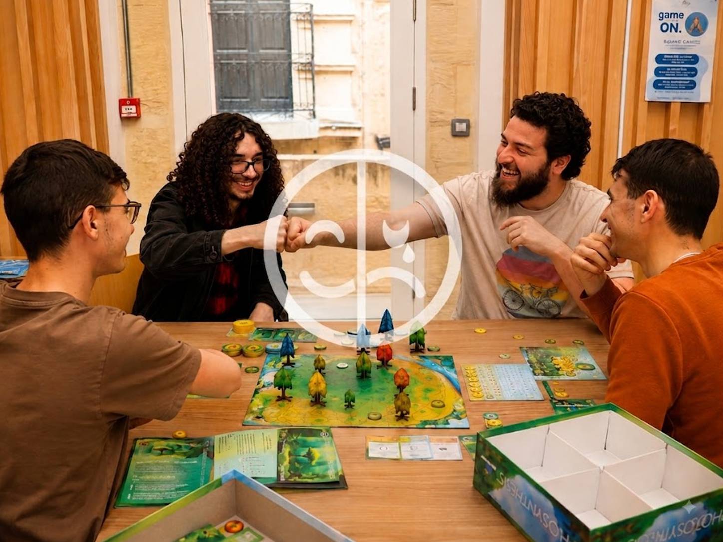 Friends laughing and reacting during a competitive board game session