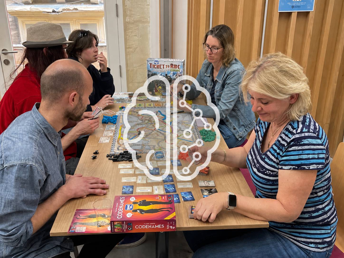 Players using critical thinking and decision-making during a board game