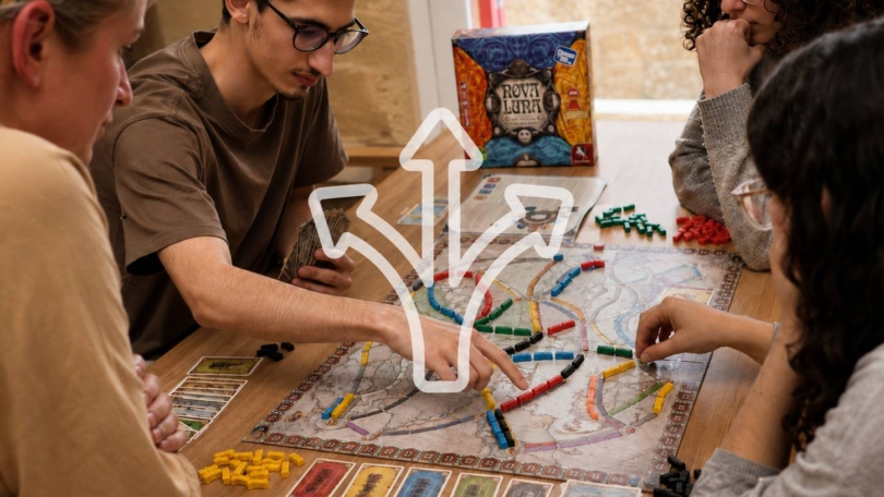 Young people considering their next move during a strategy board game