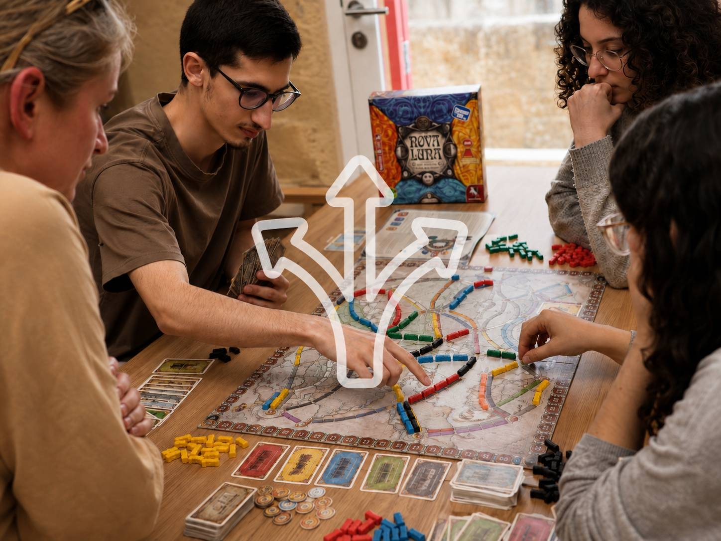 Young people considering their next move during a strategy board game