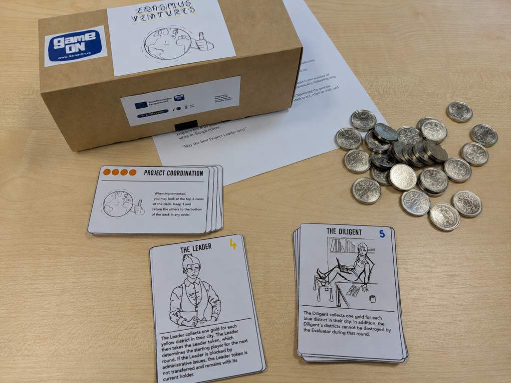 ErasmusVentures board game prototype with illustrated cards, project cards, game currency and the handmade prototype box.